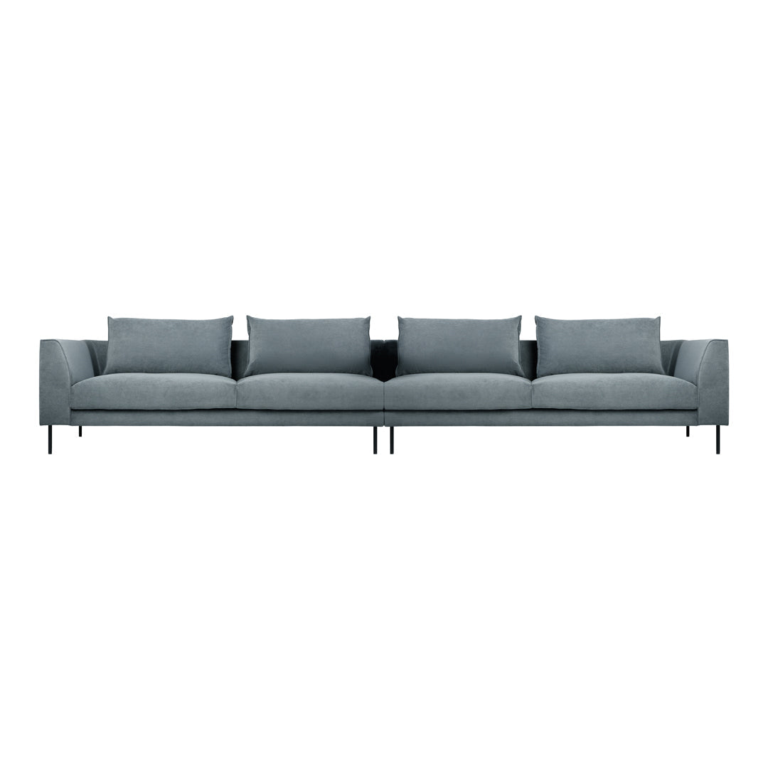 Long grey sofa with plush cushions and sleek black legs, featuring a minimalist design and solid color pattern.