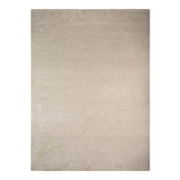 Beige area rug with a solid, textured pattern, perfect for adding warmth to any space.