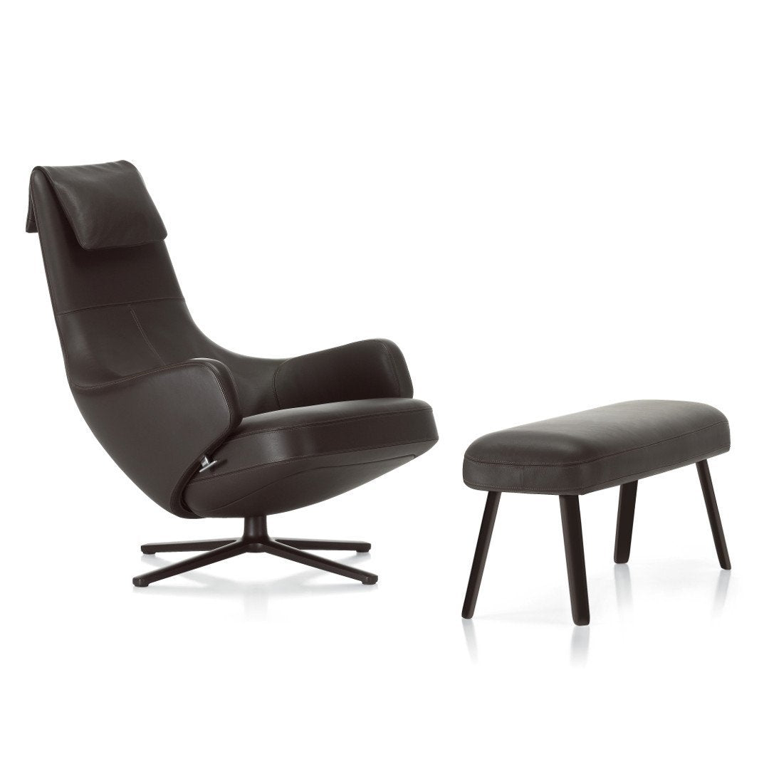 Black leather chair and ottoman set with a smooth, modern design, featuring a sleek, matte finish and minimalistic style.