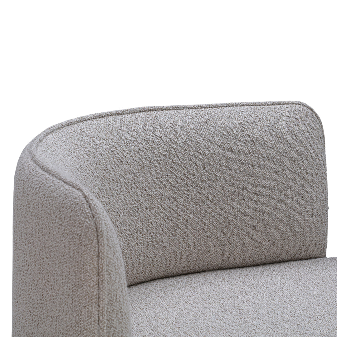 Light gray upholstered armchair with a textured, subtle patterned fabric. Ideal for modern and minimalist decor.