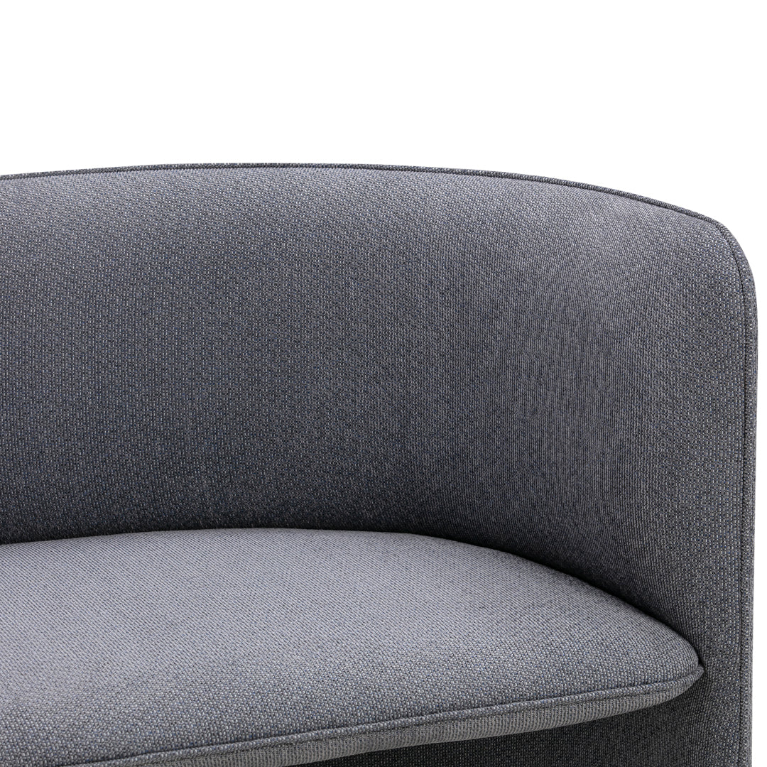 Gray upholstered chair with a textured pattern and smooth cushion, featuring a modern curved design.