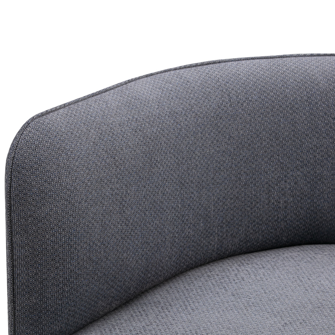 Gray textured upholstery with subtle patterns and smooth curved edges, perfect for modern decor.