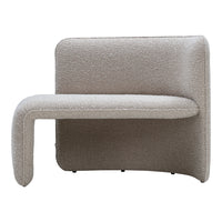 Beige upholstered chair with a smooth, curved design and textured, cozy finish. Ideal for modern interior decor.