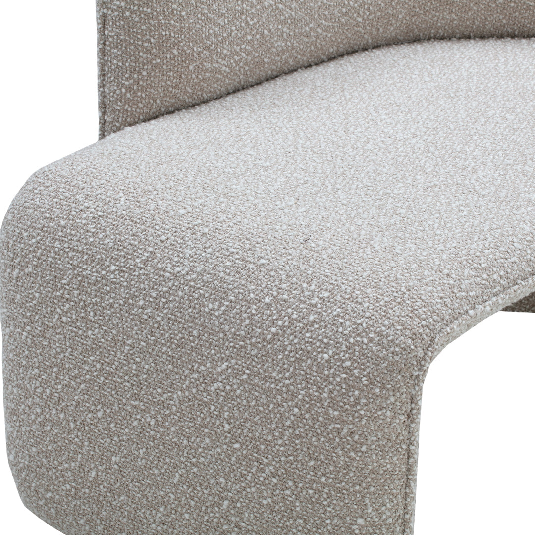 Soft beige fabric with subtle speckled pattern, perfect for modern furniture aesthetics.