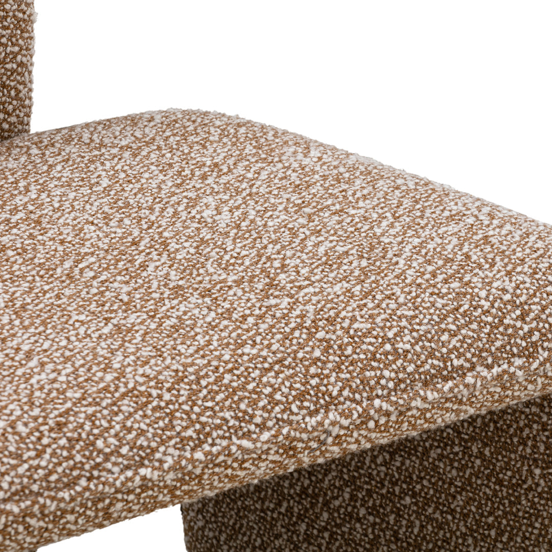 Brown textured fabric with a speckled white pattern, adding a modern touch to furniture design.