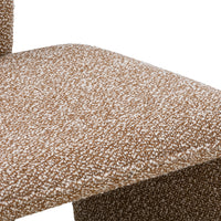 Brown textured fabric with a speckled white pattern, adding a modern touch to furniture design.