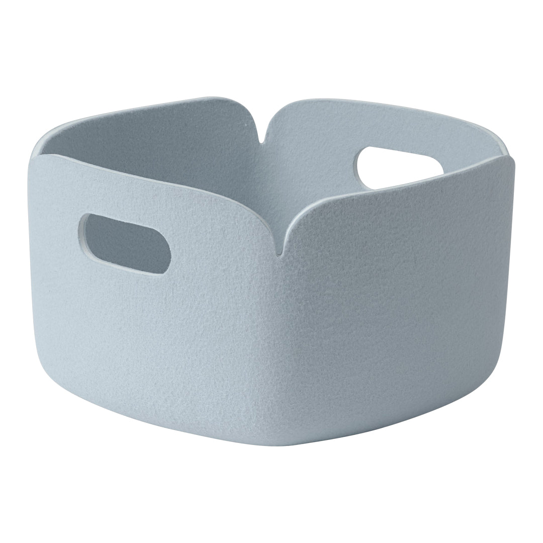 Light blue storage basket with a smooth, textured finish and practical cut-out handles, perfect for organizing.