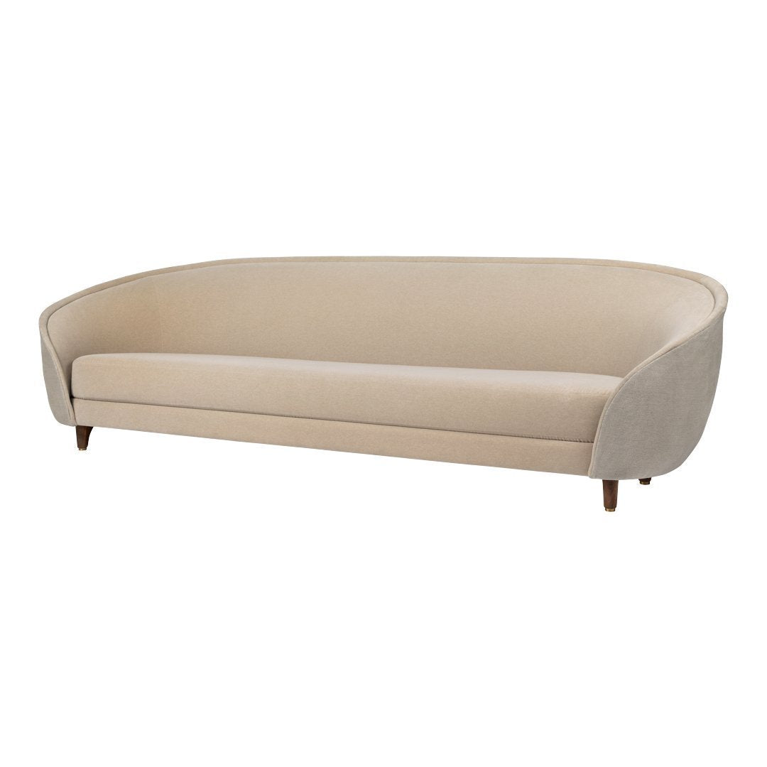 Beige curved sofa with a smooth finish and tapered wooden legs, perfect for modern living spaces.