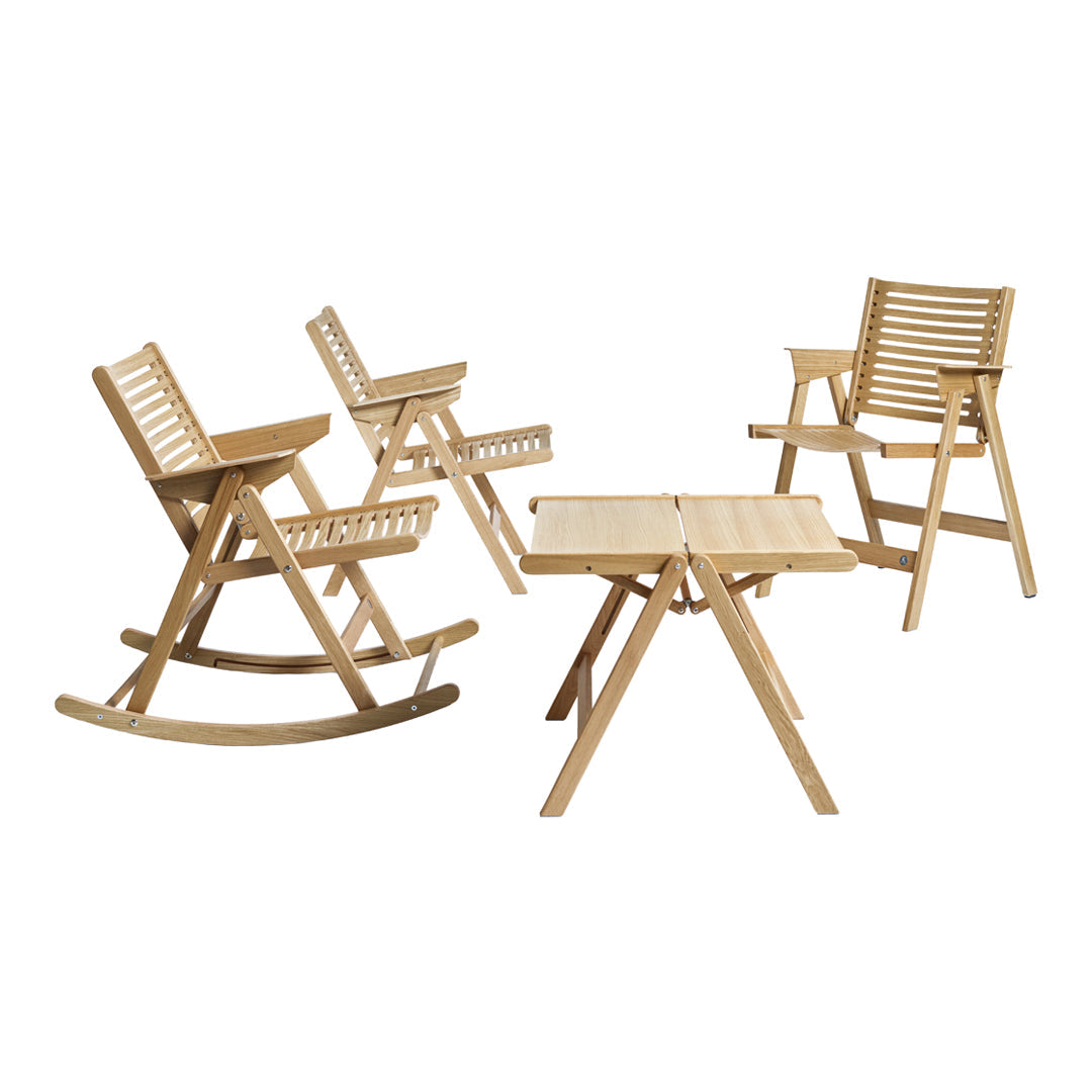 "Natural wood finish with slatted design; warm beige tones in rocking chairs and table for a cozy outdoor setting."