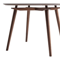 Modern wooden table with a dark walnut finish and sleek, minimalist design featuring tapered legs.