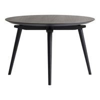 Round black coffee table with a textured dark wood top and sleek black legs, perfect for modern decor.
