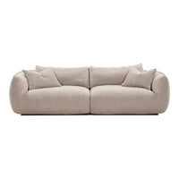 Beige sofa with a textured pattern and plush cushions, creating a cozy and inviting look for any space.