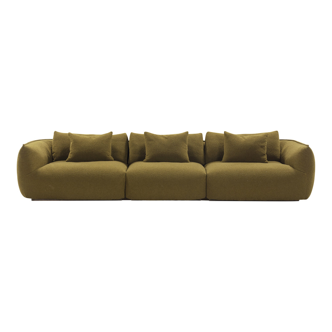Olive green sofa with plush, textured fabric and matching cushions in a modern, rounded design.