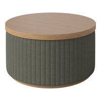 Round coffee table featuring a natural wood top and green ribbed fabric base, adding a modern touch to any space.