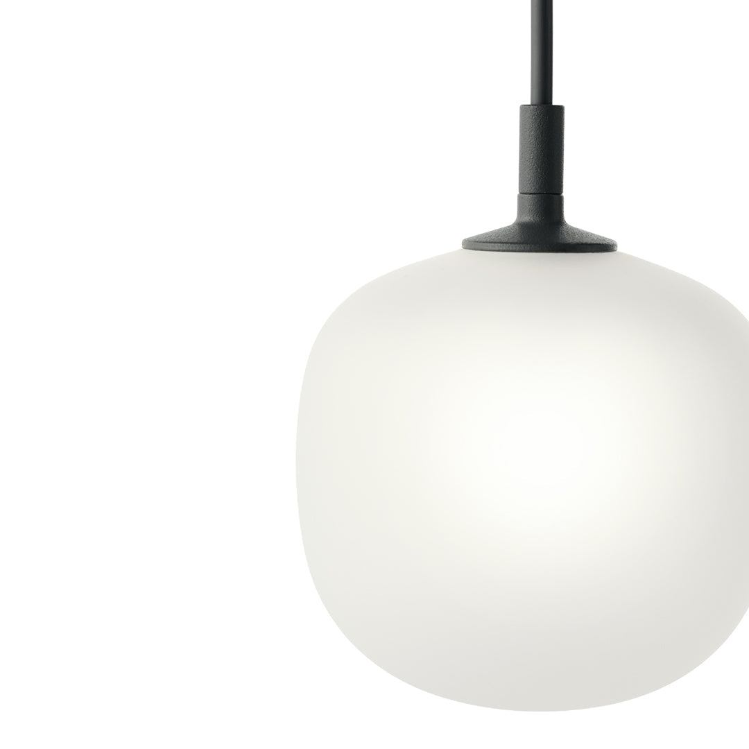 White spherical pendant light with a sleek black hanging cord, featuring a smooth, minimalist design.