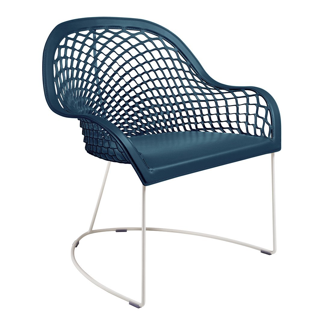 Teal mesh chair with a modern grid pattern and sleek white metal legs for contemporary decor.