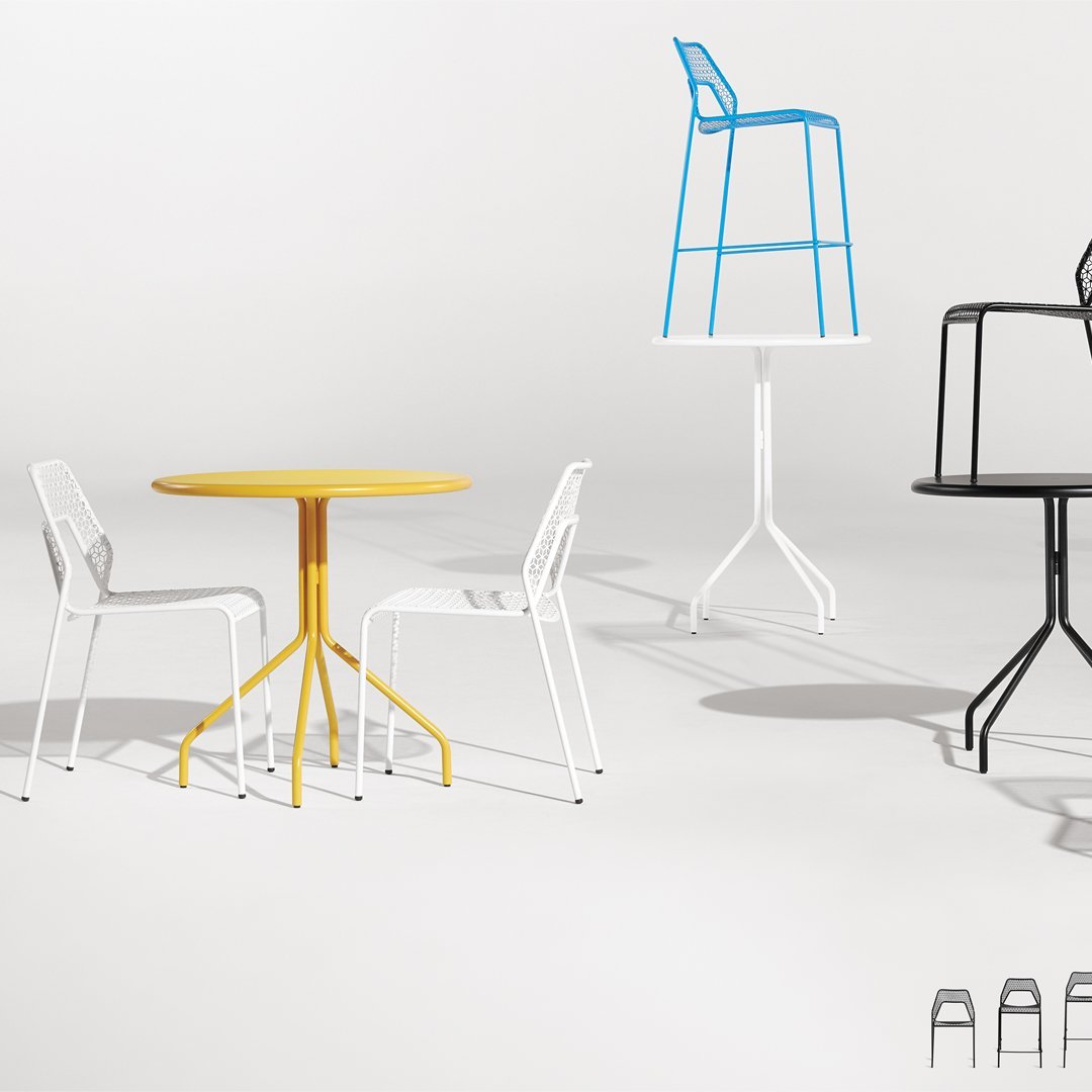 Colorful modern furniture set featuring yellow, blue, and white designs with geometric patterns and sleek lines.