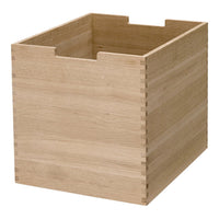 Natural wood storage box in a light oak finish with smooth, minimalistic design and visible grain patterns.