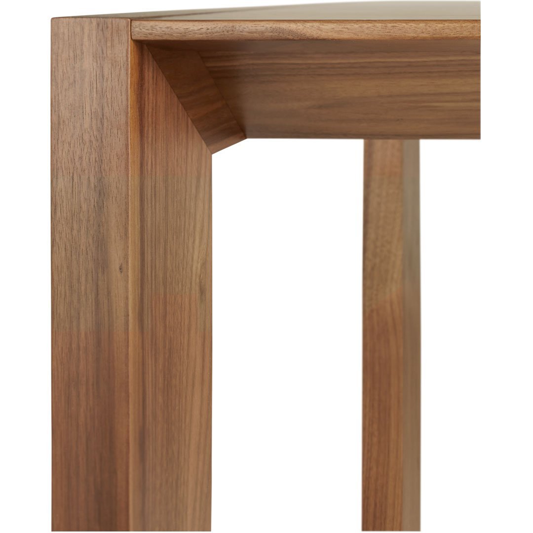Walnut wood table leg with a smooth, rich brown finish and subtle grain pattern, perfect for modern decor.