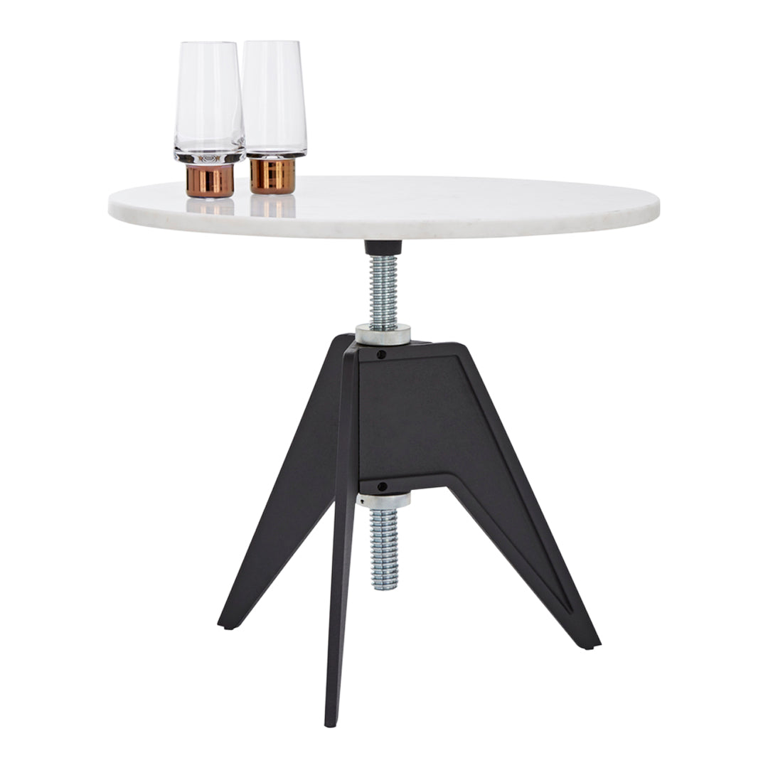 Modern round white tabletop with a black geometric base, featuring sleek metallic accents. Perfect for any contemporary space.