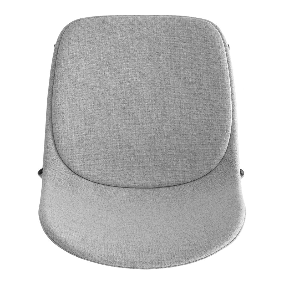 Light gray upholstered chair with a smooth, minimalist design and subtle texture. Perfect for modern interiors.