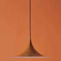 Orange pendant lamp with a sleek, modern design and smooth, curved silhouette against a matching orange background.