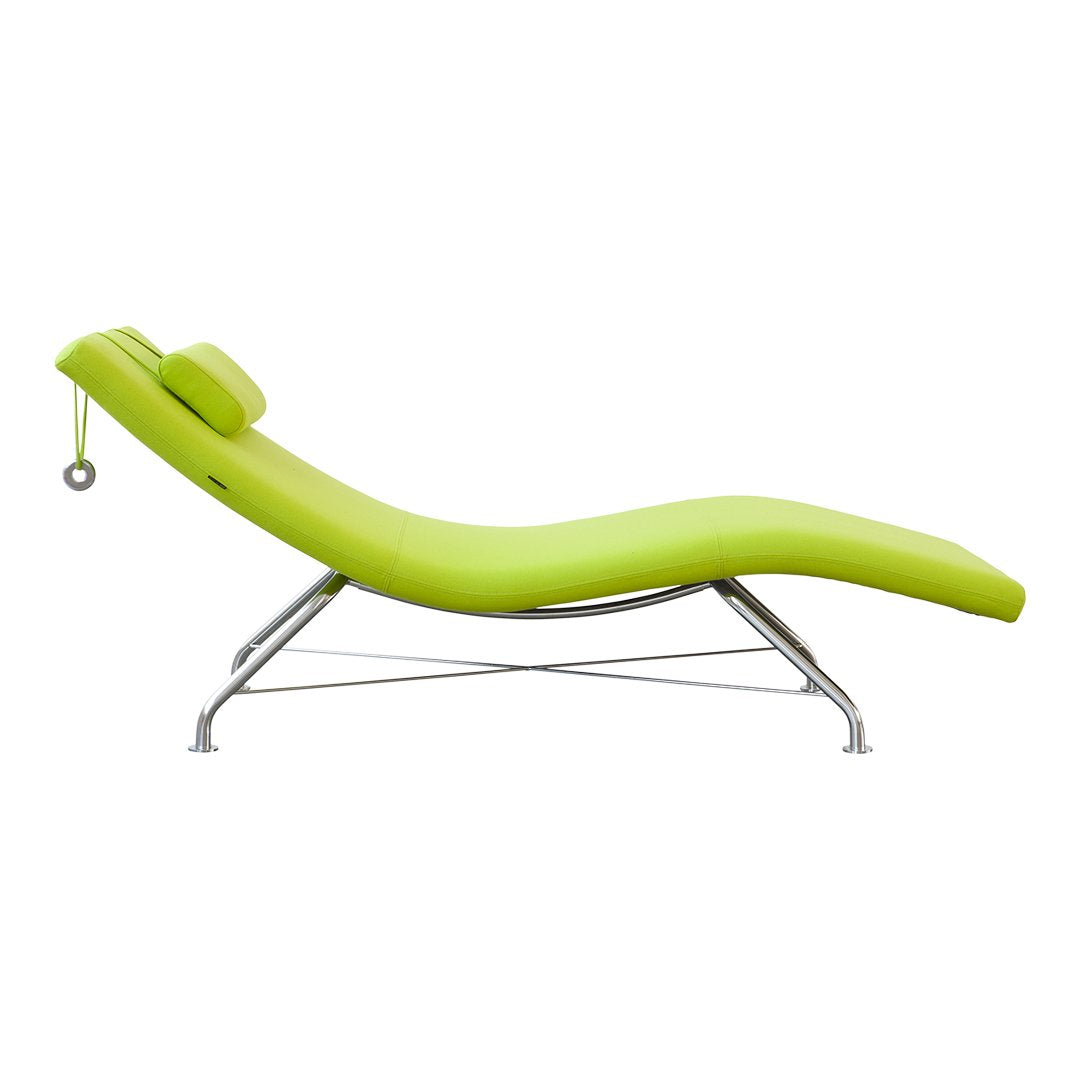 Vibrant lime green chaise lounge with smooth curves and modern chrome legs, perfect for contemporary decor.
