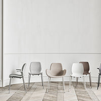 Set of modern chairs in gray, beige, white, and black, featuring sleek designs and textured upholstery.
