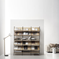 Modern metal bookshelf with wooden shelves in light natural tones, displayed against a minimalist white background.