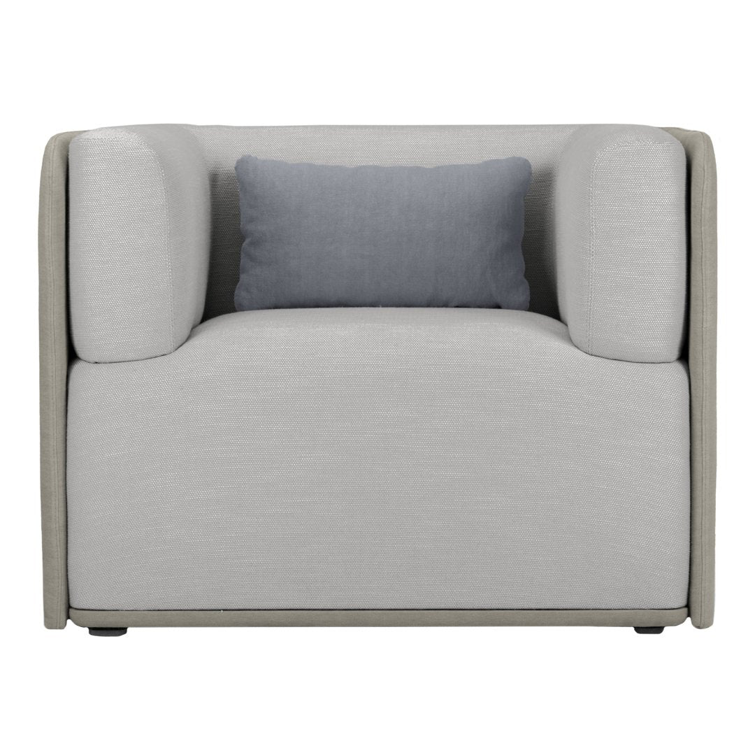 Stylish gray armchair with a light gray fabric and contrasting dark blue cushion for modern decor.