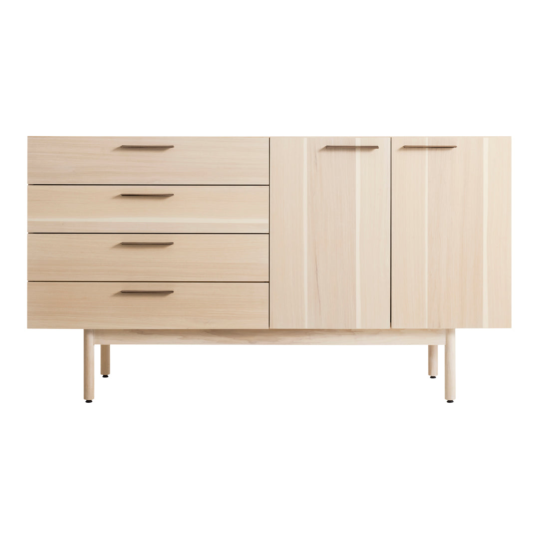 Light wood sideboard with smooth finish, featuring vertical and horizontal grain patterns, four drawers, and a cabinet.