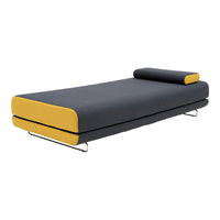 Modern gray sofa bed with vibrant yellow trim and a sleek, minimalistic design. Features a matching pillow.