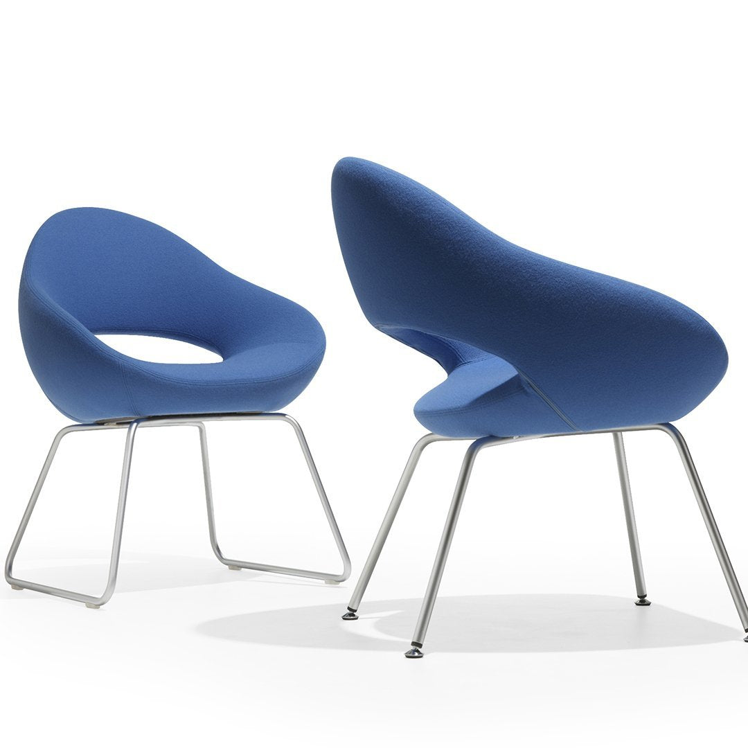 Stylish blue chairs with smooth curves and a modern design, featuring sleek metallic legs. Perfect for contemporary decor.