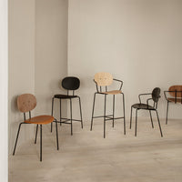 Stylish chairs in beige, brown, and black with minimalist metal frames, showcasing modern design and subtle patterns.