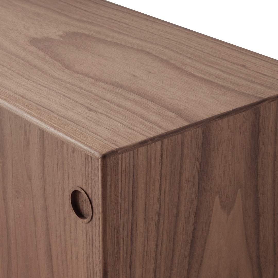Walnut wood surface with rich brown tones and subtle grain patterns, showcasing natural beauty and texture.