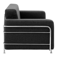"Modern black sofa with sleek silver metal frame and minimalist design, perfect for contemporary decor."