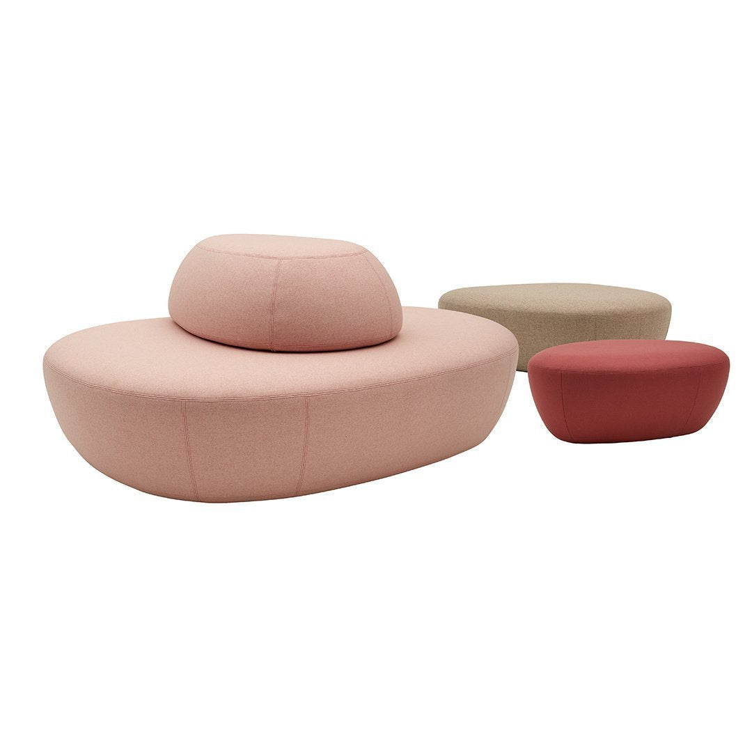 Soft pink, muted beige, and deep red seating with smooth, curved shapes and minimalistic design.