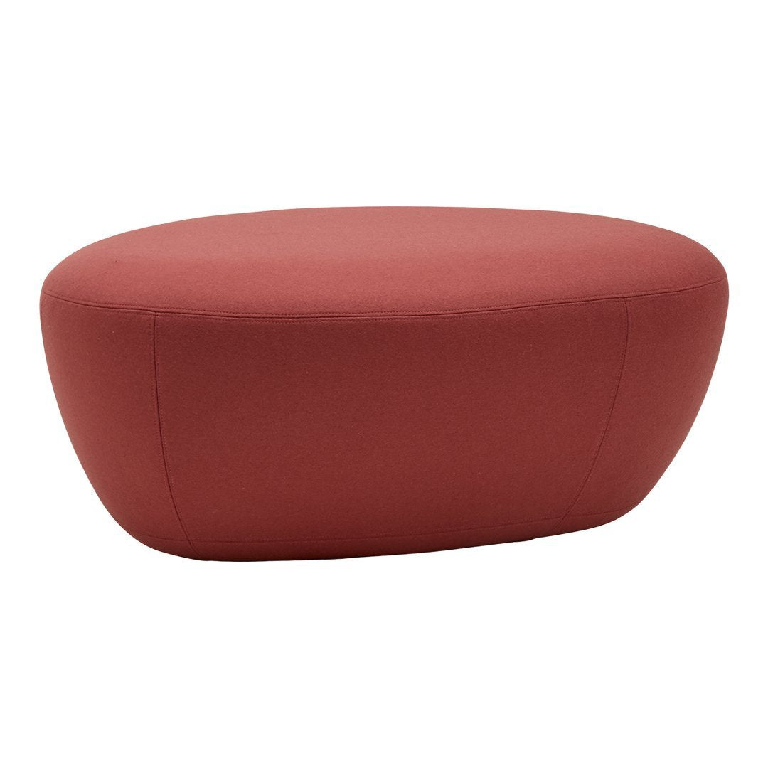 Red oval ottoman with a smooth, solid fabric surface, perfect for modern decor.