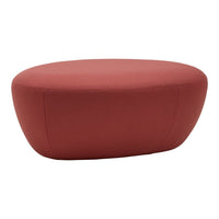 Red oval ottoman with a smooth, solid fabric surface, perfect for modern decor.