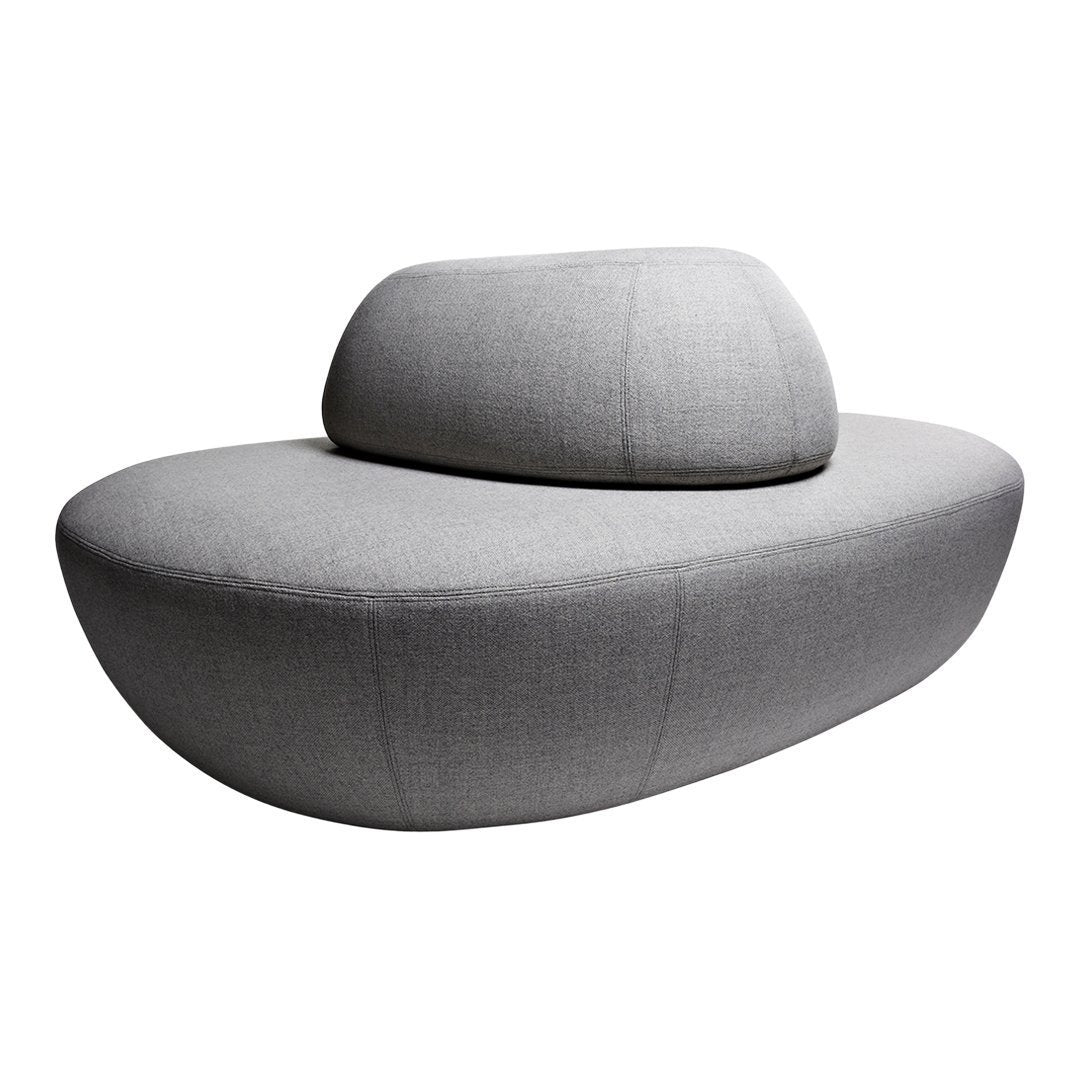 Modern gray sofa with a unique, curved shape and textured fabric pattern. Ideal for contemporary interiors.
