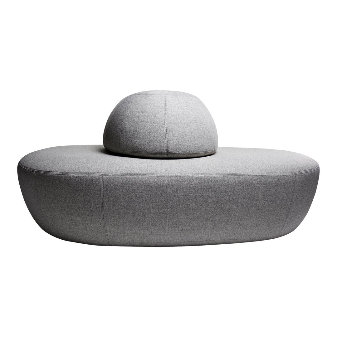 Modern gray sofa with smooth, rounded shapes and a minimalist design, featuring a soft textured fabric.