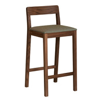 Solid walnut bar stool with a textured green seat cushion, featuring clean lines and a minimalist design.