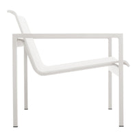 Minimalist white chair with a sleek, modern design and clean lines, perfect for contemporary decor.