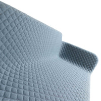 Soft blue sofa with a diamond quilted pattern, showcasing a textured, cozy look perfect for modern decor.