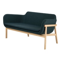 Modern dark green upholstered sofa with smooth curves, complemented by light wooden legs for a stylish contrast.