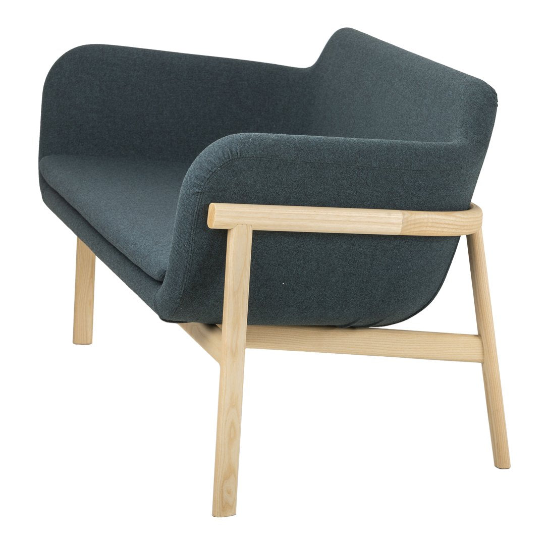Modern two-tone armchair featuring dark gray upholstery and natural wood legs. Stylish minimalist design for any decor.
