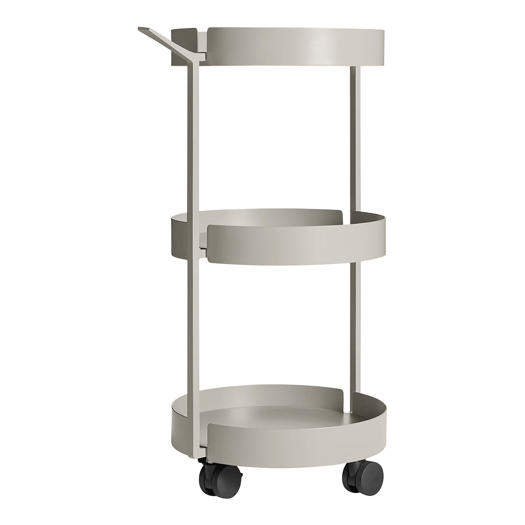 Gray metal rolling cart with three round trays and a minimalist design. Smooth finish with a sleek, modern look.