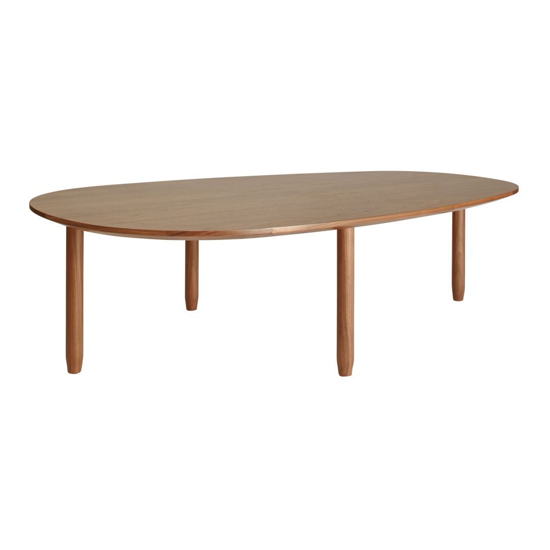 Natural wood oval dining table with light brown finish and sleek, rounded edges, complemented by smooth wooden legs.