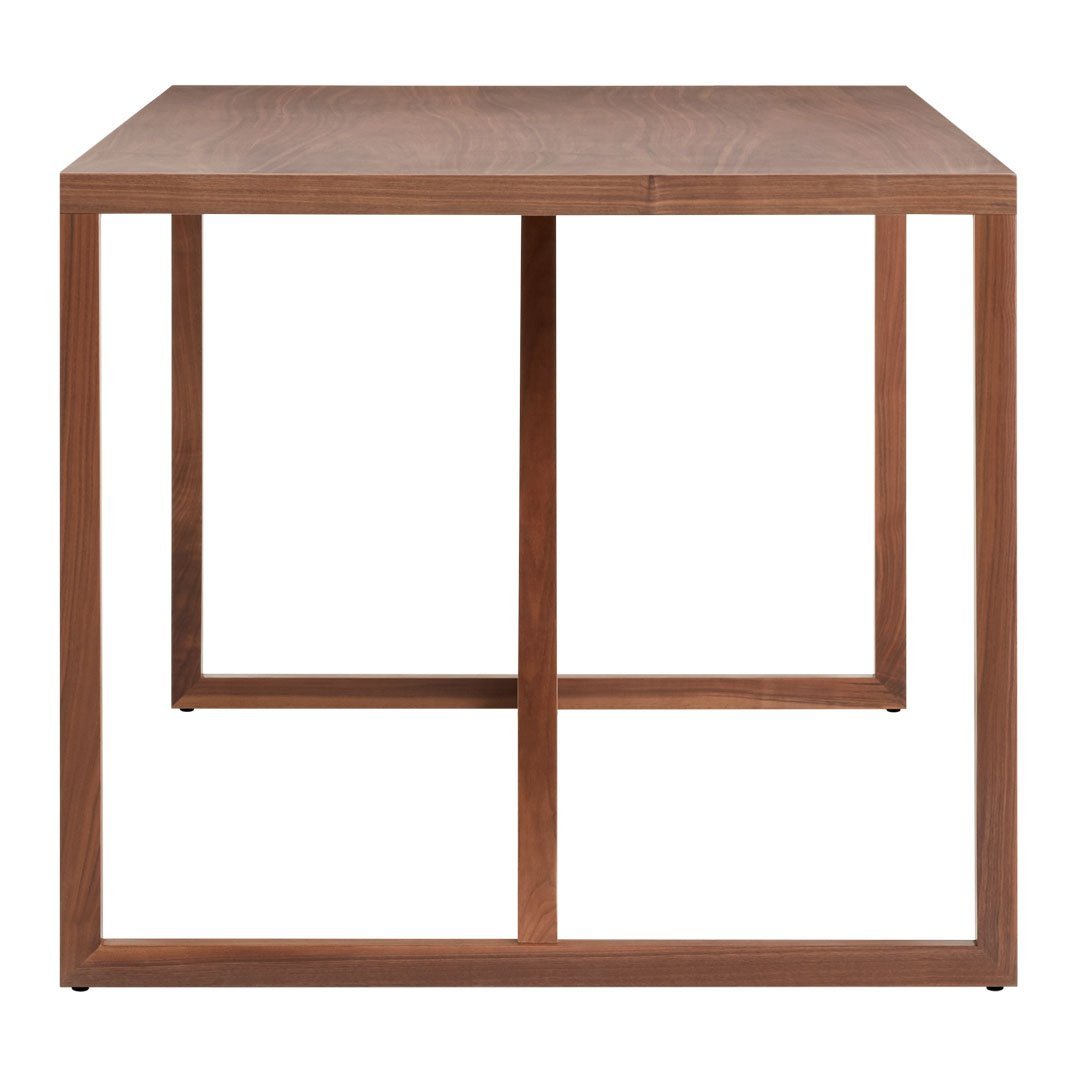 Square wooden table with a rich walnut finish and minimalist metal frame in warm brown tones.