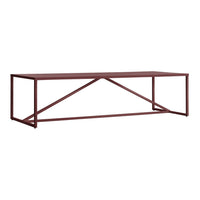 Rectangular coffee table in deep burgundy with a sleek metal frame and minimalist cross-support design.